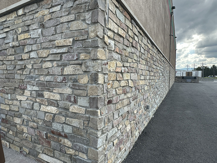 Natural Facing Cedarfield Ledgestone real stone veneer installed on a commercial property corner