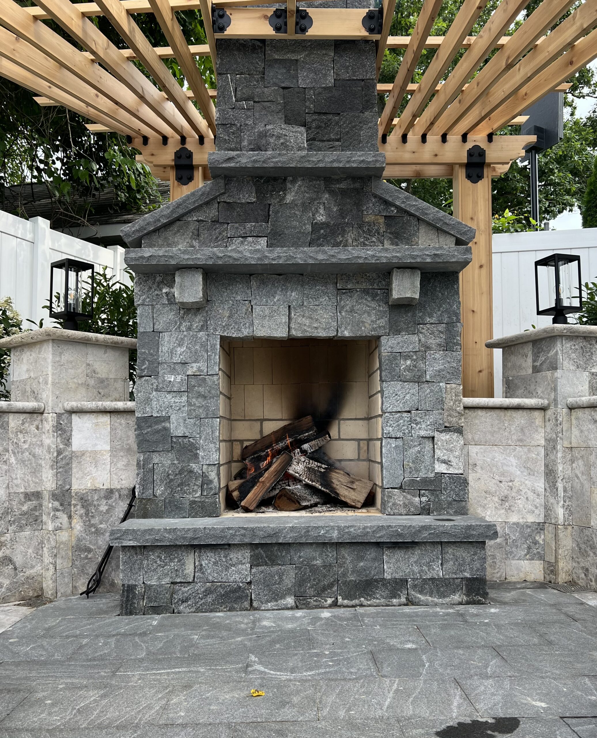 Outdoor fireplace using Cromwell Valley Roughly Rectangular natural stone veneer from Natural Facing