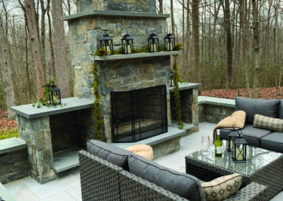 Outdoor fireplace featuring Ocean Blue Ledgestone from Natural Facing