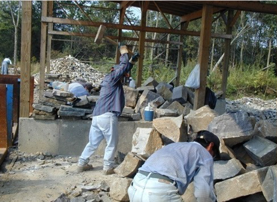 Masons trimming stones at the Quarry