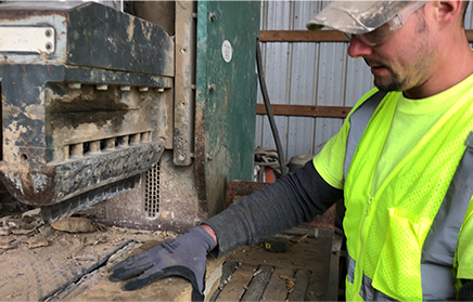 Mason trimming stone to make natural stone veneer