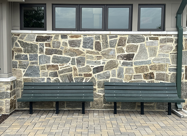 Natural Facing Ramone Brown Mosaic Sawn Thin Stone installed on a wall near a park bench