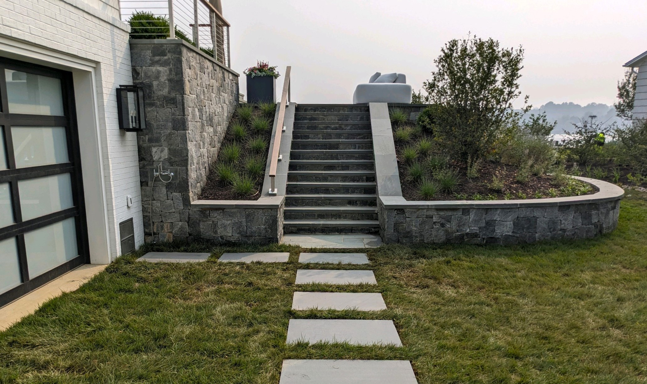 Cromwell Valley roughly rectangular natural stone veneer installed on stairs and a retaining wall