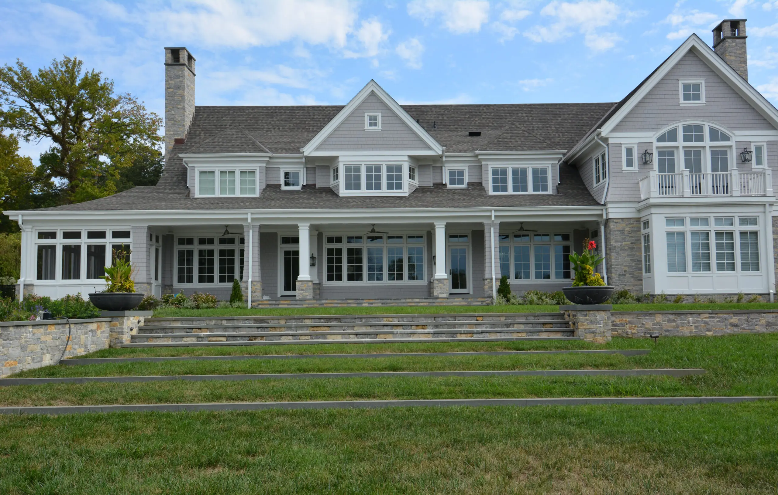 Heubert County home with stair and retaining wall